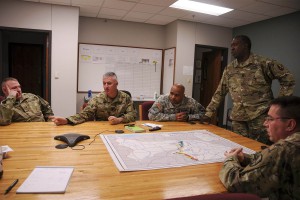 Lt. Col. Larry Benton, deputy brigade commander of the 225th Engineer Brigade, along with other members of the brigade staff brief the battalions of their missions in response to the Mississippi River flooding during a conference call on Jan. 5. The brigade has been tasked with helping with levee patrols and providing equipment in response to the flooding of the Mississippi River. (National Guard Photo by Sgt. Noshoba Davis)