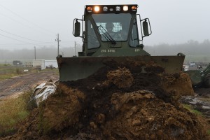 Louisiana National Guard Pvt. Taner Mansur of Walker La., assigned to the 769th Brigade Engineer Battalion, 256th Infantry Brigade Combat Team, drivers a M105 Deployable Universal Combat Earthmover to repair a levee in Krotz Springs, La., in advance of expected river flooding, Jan. 8, 2016. The Louisiana National Guard has now mobilized more than 250 personnel in an effort to build protective barriers against the approaching flood waters and to patrol levees in support of local, parish and state officials at the request of the Governor’s Office of Homeland Security and Emergency Preparedness. (U.S. Air National Guard photo by MSgt. Toby Valadie)