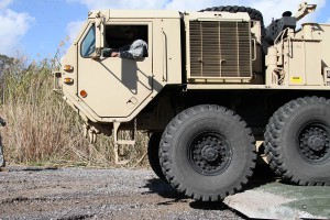 The Louisiana National Guard’s 2225th Multi Role Bridge Company ferries a fuel truck from Amelia, La., to Avoca Island to support a mission to build 2 miles of levees to protect Morgan City from backwater flooding due to high river levels, Jan. 9, 2015. (U.S. Army National Guard photo by Spc. Garrett L. Dipuma)