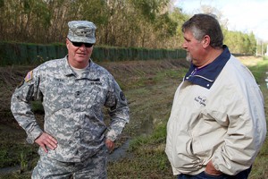 Maj. Gen. Glenn H. Curtis, adjutant general of the Louisiana National Guard confers with Carroll B. Snyder, mayor of Krotz Springs, Louisiana, while members of the LANG’s 769th Brigade Engineer Battalion, 256th Infantry Brigade Combat Team, worked in partnership with the community of Krotz Springs and the Department of Transportation and Development to build protective flood barriers in Krotz Springs, Louisiana, in support of Operation Winter River Flooding, Jan. 9, 2016. The Guardsmen worked in 18 separate locations to fill and lay down sandbags, erect and fill HESCO bastion, and construct land berms around the perimeter of the city to prevent any flooding. (U.S. Army National Guard photo by Spc. Tarell J. Bilbo/Released)