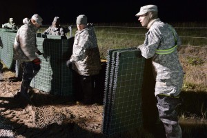 The Louisiana National Guard continues to work around the clock, constructing HESCO barrier levees on Avoca Island, La., Jan. 10, 2016. The project will prevent backwater flooding from reaching Morgan City and other towns in south Louisiana due to high river levels. (U.S. Army National Guard photo by Spc. Joshua Barnett)
