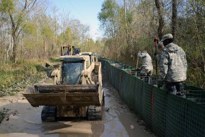 The Louisiana National Guard continues to work around the clock, constructing HESCO barrier levees on Avoca Island, La., Jan. 11, 2016. The project will prevent backwater flooding from reaching Morgan City and other towns in south Louisiana due to high river levels. (U.S. Army National Guard photo by Spc. Joshua Barnett)
