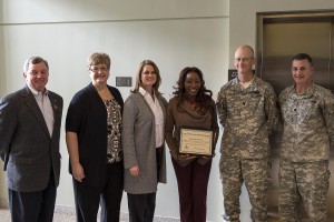 Shinnah Brown, a survivor outreach coordinator was honored with an award for superior performance during a ceremony at Jackson Barracks in New Orleans, Jan. 28, 2016. Brown provides services to the families of Army Soldiers who die in the line of duty. She was awarded the HRCI Superior Performance Award by her employer, Human Resources Consulting, Inc. (U.S. Army National Guard photo by Spc. Joshua Barnett) 