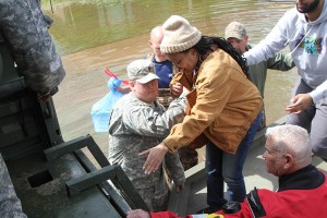 Louisiana Army National Guardsmen of the 139th Regional Support Group assist residents at Golden Meadow subdivision evacuate their homes due to the massive flooding throughout the state in Bossier City, La, Mar. 10, 2016. (U.S. Army National Guard photo by Staff Sgt. Jerry W. Rushing)