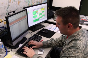 Louisiana Air National Guardsman Tech Sgt. Christopher Fish of the 159th Fighter Wing from Metairie, La., checks spreadsheets in the Point of Distributions Inventory System (PODIS) during flood operations in Baton Rouge, La., March 16, 2016.The PODIS is a vital part of conducting distribution operations after emergencies. (US Army National Guard photo by Spc. Garrett L. Dipuma)