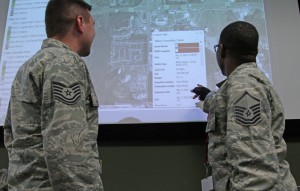 Louisiana National Guardsmen Tech Sgt. Christopher Fish (left) and Master Sgt. Kimani Cadney (right) accounting for a shipment of water that is being delivered to flood victims using the Point of Distributions Inventory System in Baton Rouge, La., March 16, 2016. The PODIS system is a vital part of conducting distribution operations after emergencies, automatically calculating how much of a given commodity is being used as well as commodities that are in route to any location in real time. (US Army National Guard photo by Spc. Garrett L. Dipuma)