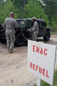 Staff Sgt. John C. Van, left, an administrative noncommissioned officer with the Louisiana National Guard's 199th Leadership Regiment, assists Soldiers refueling their vehicle during a Joint Reception, Staging, Onward Movement and Integration (JRSOI) simulation exercise as part of Vigilant Guard 2016 at Camp Minden, in Minden, La., April 15, 2016. The JRSOI center is established to in-process units that would arrive in Louisiana if assistance was requested as part of the Emergency Management Assistance Compact and has the capabilities to feed and lodge a maximum of 1,100 personnel while they receive briefings and transition to the next aspect of their mission. (U.S. Army National Guard photo by Spc. Tarell J. Bilbo/Released)