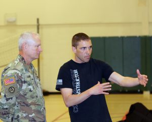 Staff Sgt. Thomas Dubois, of the 199th Regional Training Institute at Camp Minden, La., explains some close combat maneuvers to Maj. Gen. Barry P. Keeling, the assistant adjutant general for the Louisiana National Guard, at Camp Shelby, in Hattiesburg, Mississippi, June 11, 2016. Keeling toured various training locations throughout Camp Shelby and met with Soldiers during their annual training. (U.S. Army National Guard photo by Capt. Anthony G. Kelly, 139th Regional Support Group)
