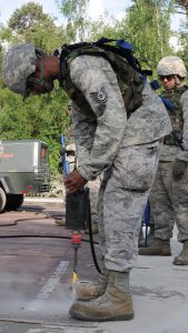 Tech. Sgt. Eric Norwood, 159th Civil Engineer Squadron, Louisiana Air National Guard drills a hole in the concrete to secure a fiberglass to the runway during a Silver Flag exercise, at Silver Flag June 11, 2016, Ramstein Air Base, Germany. Silver Flag is a weeklong simulated bare base bed down and sustainment operations in a contingency environment. (U.S. Air National Guard photo by 1st Lt. Larissa Lambert/Released)