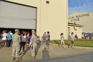 Members of the 122nd Air Support Operations Squadron and the 259th Air Traffic Control Squadron, Louisiana Air National Guard assist a flood evacuee at a makeshift movie studio shelter at Celtic Media Centre in Baton Rouge, La. on August 15, 2016. The Louisiana National Guard mobilized more than 1,000 guardsmen in response to heavy flash flooding that occurred in south Louisiana on August 13, 2006. (U.S. Air National Guard Photo by Master Sgt. Dan Farrell)