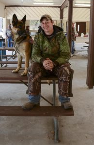 Joshua Droddy, a former sergeant with the Louisiana National Guard's A Company, 3rd Battalion, 156th Infantry Regiment, 256th Infantry Brigade Combat Team and his service dog, Grunt, relax after spending the morning in a blind at the Disabled Veteran's Hunt at the Camp Beauregard Wildlife Management Area near Pineville, Louisiana, Nov. 11-13, 2016. Droddy drove from Colorado Springs, Colorado to participate in the hunt. (U.S. Army National Guard photo by Sgt. Noshoba Davis)