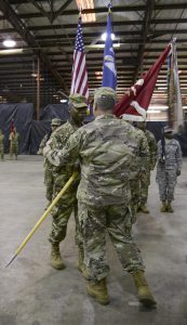 Maj. Stewart Adams, a Little Rock, Arkansas native and the incoming commander of the Louisiana National Guard's 527th Engineer Battalion, receives the organizational colors from Maj. Gen. Glenn H. Curtis, adjutant general of the LANG, during an official change of command ceremony at the battalion headquarters in Ruston, Louisiana, Dec. 3, 2016. Adams is currently the administrative officer for the battalion as well as commander. (U.S. Army National Guard photo by Sgt. Noshoba Davis)