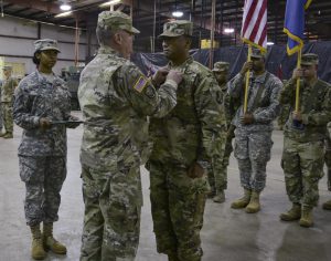 Maj. Gen. Glenn H. Curtis, the adjutant general of the Louisiana National Guard, presents outgoing commander Lt. Col. Willus Hall, a Dallas, Texas, native with the Meretorious Service Award during an official change of command ceremony at the battalion headquarters in Ruston, Louisiana, Dec. 3, 2016. Hall handed over command to Maj. Stewart Adams, a native of Little Rock, Arkansas, native, and will be assigned as the chief of operations. (U.S. Army National Guard photo by Sgt. Noshoba Davis)