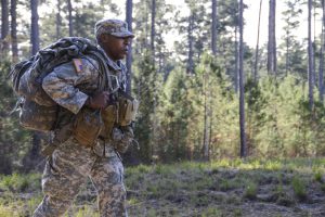 Louisiana National Guardsman 1st Lt. Joseph Jackson, of C Troop, 2nd Squadron, 108th Cavalry Regiment, 256th Infantry Brigade Combat Team keeps a steady pace while trying to finish a 12 mile ruck march during the first stage of the annual Spur Ride at Camp Minden in Minden, Louisiana, Dec. 10, 2016. Jackson finsihed the ruck march first with a record time of three hours and nine minutes. (U.S. Army National Guard photo by Sgt. Noshoba Davis)