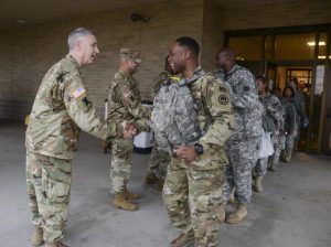 Louisiana National Guard's Lt. Col. Richard Douget, commander of the 773rd Military Police Battalion, shakes hands with Soldiers as they depart for the District of Colombia to serve with the specially created Joint Task Force – District of Columbia to support the 58th Presidential Inauguration, Jan. 18, 2017. This is the first presidential inauguration that the 773rd has conducted security operations for. (U.S. Army National Guard photo by Sgt. Noshoba Davis)