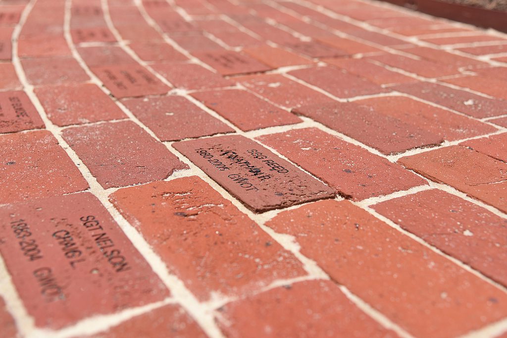 Bricks memorializing fallen Louisiana National Guardsmen at the base of a new monument at Louisiana Veterans Memorial Park in Baton Rouge, Louisiana, May 21, 2019. (U.S. Army National Guard photo by Staff Sgt. Garrett L. Dipuma)