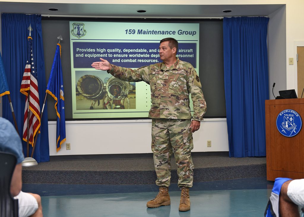 159th Fighter Wing, Louisiana Air National Guard Chief Master Sgt. Gerald Raynal, command chief of the 159th Fighter Wing, briefs visitors during the Wing’s “Bring a Friend to Drill” recruiting event at Naval Air Station Joint Reserve Base New Orleans in Belle Chasse, Louisiana, Aug. 4, 2019. The event introduced prospective recruits to the Louisiana Air National Guard’s mission and what benefits the organization has to offer them. (U.S. Air National Guard photo by Senior Airman Dane St. Pe)