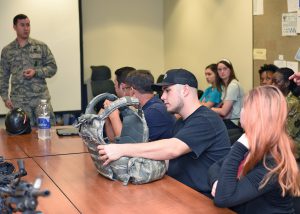 159th Security Forces Squadron, Louisiana Air National Guard Tech. Sgt. Jared Ramsey briefs visitors during the Wing’s “Bring a Friend to Drill” recruiting event at Naval Air Station Joint Reserve Base New Orleans in Belle Chasse, Louisiana, Aug. 4, 2019. The event introduced prospective recruits to the Louisiana Air National Guard’s mission and what benefits the organization has to offer them. (U.S. Air National Guard photo by Senior Airman Dane St. Pe)