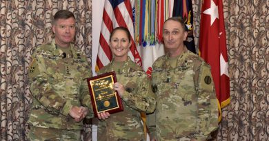 Staff Sgt. Nicole Bourgeois, 2016 TRADOC National Guard Instructor of the Year, 1st Battalion (Noncommissioned Officer Academy), 199th Regiment Regional Training Institute at Camp Cook in Ball, Louisiana, receives a plaque and congratulations from Gen. David Perkins, commanding general of U.S. Army Training and Doctrine Command, and Command Sgt. Maj. David Davenport, TRADOC senior enlisted leader, during the 2016 TRADOC Instructor of the Year ceremony at the Fort Eustis Club in Virginia, Aug. 3, 2017. (U.S. Army photo by Angel Clemons)