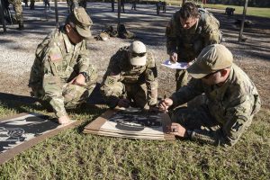 Louisiana National Guard Soldiers grade a target at the Adjutant General's Match at Camp Beauregard in Pineville, Louisiana, Oct. 11, 2018. The two-day competition included both rifle and pistol precision shooting and reflexive fire.(U.S. Army National Guard photo by Sgt. Noshoba Davis)