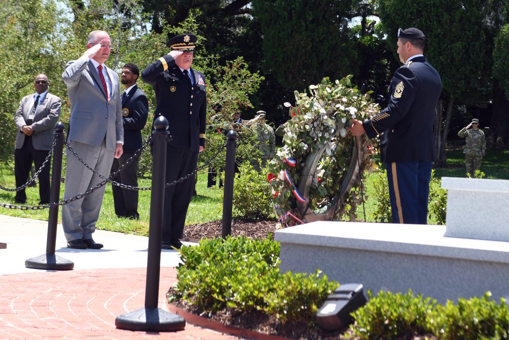 Louisiana Gov. John Bel Edwards and Maj. Gen. Glenn H. Curtis, adjutant general of the Louisiana National Guard, render a salute as Taps is played during an official ceremony memorializing a new monument honoring fallen Louisiana Guardsmen at Louisiana Veterans Memorial Park in Baton Rouge, Louisiana, May 21, 2019. (U.S. Air Force National Guard photo by Master Sgt. Toby Valadie)