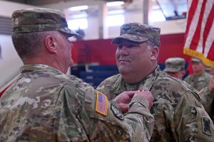 Maj. Gen. Glenn H. Curtis, adjutant general of the Louisiana National Guard, pins Col. William Rachal with the Meritorious Service Medal for his exemplary command of the 256th Infantry Brigade Combat Team at Comeaux High School in Lafayette, Louisiana, Nov. 2, 2019. Rachal relinquished command of the Tiger Brigade to Lt. Col. Scott Desormeaux after nearly three years of leading the brigade. (U.S. Army National Guard photo by Staff Sgt. Garrett L. Dipuma)