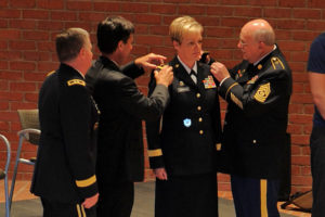 Brig. Gen. Joanne F. Sheridan, assistant adjutant general-Army, is pinned by her husband Mark Sheridan and her father Command Sgt. Major (Retired) Joe S. Fernald with the one-star rank insignia during her official promotion ceremony at Jackson Barracks Museum in New Orleans, July 27, 2012. Sheridan, who has filled numerous leadership positions and served in Iraq, is the first female general officer in the LANG and the 27th currently serving in the National Guard. (U.S. Air Force Photo by Master Sgt. Toby Valadie, Louisiana National Guard Public Affairs Office)
