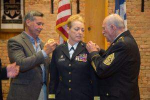 Louisiana National Guard Maj. Gen. Joanne F. Sheridan’s husband and father remove her old rank and replace it with the new rank of Maj. Gen at the Ansel M. Stroud Military History &amp; Weapons Museum at Jackson Barracks in New Orleans, July 23, 2017. In her new role as the assistant adjutant general, she now serves serves as a principal advisor to the adjutant general. She is responsible for assisting the adjutant general in the deployment and coordination of programs, policies, and plans for the LANG. (U.S. Army National Guard photo by Staff Sgt. Josiah Pugh)