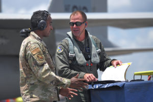Staff Sgt. Dimitri L. Bush, F-15 crew chief, and Col. Jonathan Mumme, 159th Fighter Wing commander, review aircraft records prior to a training flight takeoff at the Air Dominance Center in Savannah, Ga, June 9, 2021. The relationship between the air crew and pilot is essential to maintaining mission readiness and to ensure the aircraft is mission ready. (U.S. Air National Guard photo by Senior Master Sgt. Daniel Farrell)
