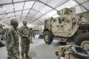 Brig. Gen. Keith Waddell, the adjutant general of the Louisiana National Guard, visits with mechanics of the 256th Infantry Brigade Combat Team, Tiger Brigade, in Kuwait. The Tiger Brigade has been conducting operations in support of U.S. Central Command’s Operations Inherent Resolve and Spartan Shield since the beginning of the year and are scheduled to return home later this year. (U.S. Army National Guard photo by Staff Sgt. Noshoba Davis)