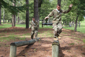 Louisiana National Guard recruits with Company A, Recruit Sustainment Program run through an obstacle course at Camp Minden in Minden, La., July 10, 2021. The training was part of their high impact training, which is designed to prepare them for life in the Guard once they get to their units. (U.S. Army National Guard photo by Cadet Anna M. Churco) 