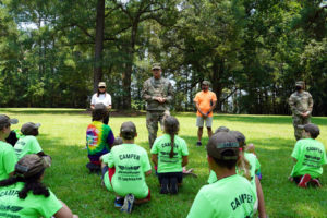 Maj. Gen. Keith Waddell, adjutant general of the Louisiana National Guard, and his wife, Lisa, speak to children of service members during the annual military kids’ Camp Pelican Pride event at the Feliciana Retreat and Conference Center in Norwood, La., Aug. 4, 2021. The youth, ranging from 8-13 years old, are divided into age-specific platoons with adult leaders, just like a military unit. The week is full of events that teach the youth about the military and what it’s like to be a Louisiana National Guardsmen. (U.S. Army National Guard photo by Sgt. 1st Class Denis B. Ricou)