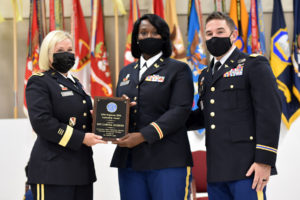 Newly promoted 2nd Lt. Laroya Dickens, Louisiana National Guard, receives the Leadership Award presented by Brig. Gen. Cindy Haygood, the LANG’s assistant adjutant general – Army, and Lt. Col. Jacques Comeaux, commander of 2nd Battalion of the 199th Regiment (RTI), at Camp Beauregard in Pineville, Louisiana, Aug. 8, 2021. (U.S. Army National Guard photo by Staff Sgt. Thea James)