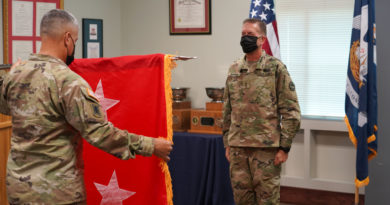 Maj. Gen. Lee Hopkins, assistant adjutant general of the Louisiana National Guard, watches as Command Sgt. Maj. Clifford Ockman, senior enlisted leader of the LANG, unfurls and presents the two-star general officer flag during his promotion ceremony at the Armed Forces Reserve Center in Baton Rouge, Louisiana, Aug. 20, 2021. Hopkins, who has served in the Army for 37 years, is currently the principal military advisor to the adjutant general of the LANG, and is responsible for assisting in the deployment and coordination of programs, policies, and plans for the Louisiana Army and Air National Guard. (U.S. Army National Guard photo by Sgt. 1st Class Denis B. Ricou)