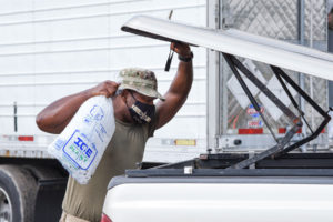 Airmen from the 159th Fighter Wing, Louisiana Air National Guard, manned Points of Distribution (POD) sites distributing food, water, ice and tarps to residents in Raceland, Louisiana, Sept. 1, 2021. POD members adhered to COVID-19 protocols while ensuring those in need received essential supplies to help alleviate the burden following Hurricane Ida. (U.S. Air National Guard photo by Staff Sgt. Ryan J. Sonnier)