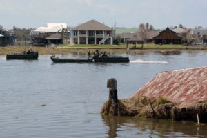 Louisiana National Guardsmen assigned to the 2225th Multi-Role Bridge Company, 225th Engineer Brigade push a section of the Improved Ribbon Bridge, Laffite, Louisiana, Sept. 3, 2021. The engineers built a temporary bridge to Barataria after the only bridge to the community was destroyed during Hurricane Ida. (U.S. Army National Guard photo by Staff Sgt. David Kirtland)