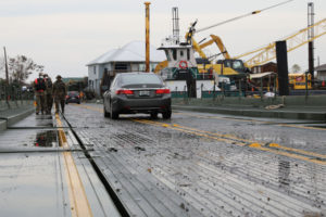 Cars cross an Improved Ribbon Bridge after Hurricane Ida in Jean Lafitte, La., Sept. 8, 2021. Louisiana National Guardsmen assigned to the 2225th Multi-Role Bridge Company, 225th Engineer Brigade constructed the temporary floating bridge after storm surge from Ida damaged the only bridge that connects to Barataria. (U.S. Army National Guard photo by Staff Sgt. Josiah Pugh)