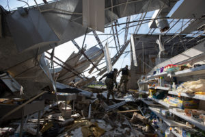 Spc. David Williams and Spc. Tameisha McKay, Alabama National Guard 214th Military Police Company, guards a destroyed Walgreens against looters in the aftermath of Hurricane Ida, Larose, LA, Sep. 9, 2021. (Alabama National Guard photo by SSG William Frye).