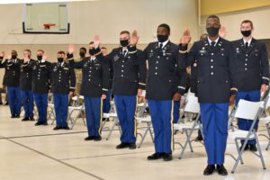 Newly commissioned Louisiana Army National Guard (LAARNG) second lieutenants take the Oath of Commissioned Officers at an Officer Candidacy School (OCS) graduation at Camp Beauregard, Pineville, Louisiana, Aug. 8, 2021. The LAARNG commissioned 21 new officers through their OCS school last fiscal year. Over the last year, the Louisiana Army National Guard sent nearly 750 Soldiers to various military professional development and additional skill identifier schools around the country, October 2020 – October 2021. (U.S. Army National Guard photo by Staff Sgt. Thea James)