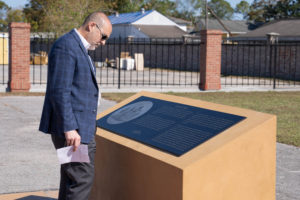 Attendees view historical markers following a Louisiana National Guard dedication ceremony for a memorial greenspace to honor the Native Americans, soldiers, civilians and enslaved people who lived, served and died at Jackson Barracks, New Orleans, Nov. 19, 2021. The greenspace is the result of a 2009 agreement among various state and federal agencies to include various Native American tribes, the Federal Emergency Management Agency, the Advisory Council on Historic Preservation, the Louisiana State Historic Preservation Office, the State of Louisiana, the Division of Administration, Facility Planning and Control, and the Louisiana Military Department. (U.S. Army National Guard photo by Staff Sgt. Josiah Pugh)
